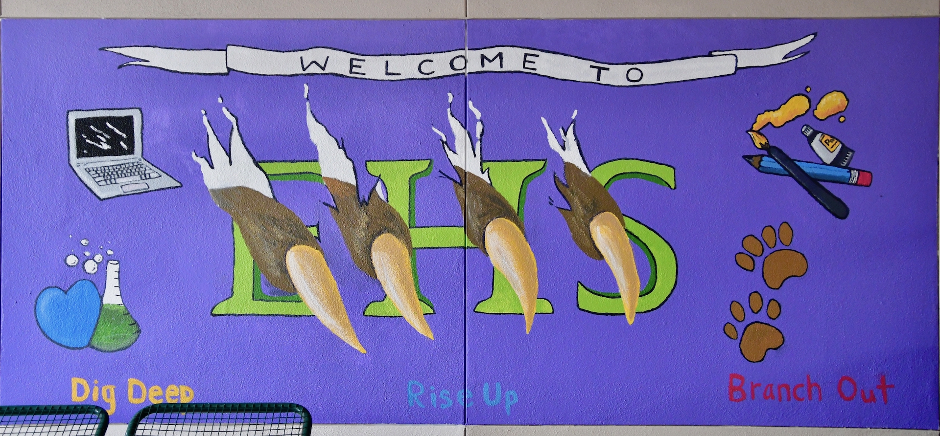 One of two murals painted at the front of the school through student donations and artwork. Photo by Patrick Robinson 