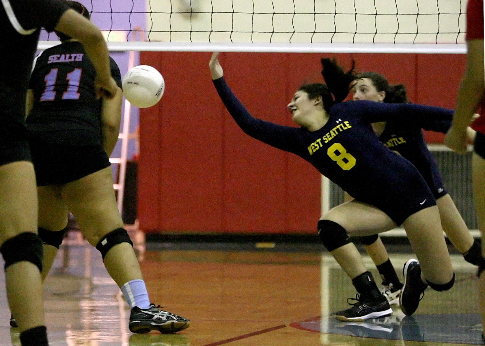 The ball just gets by Calista Januto of West Seattle.