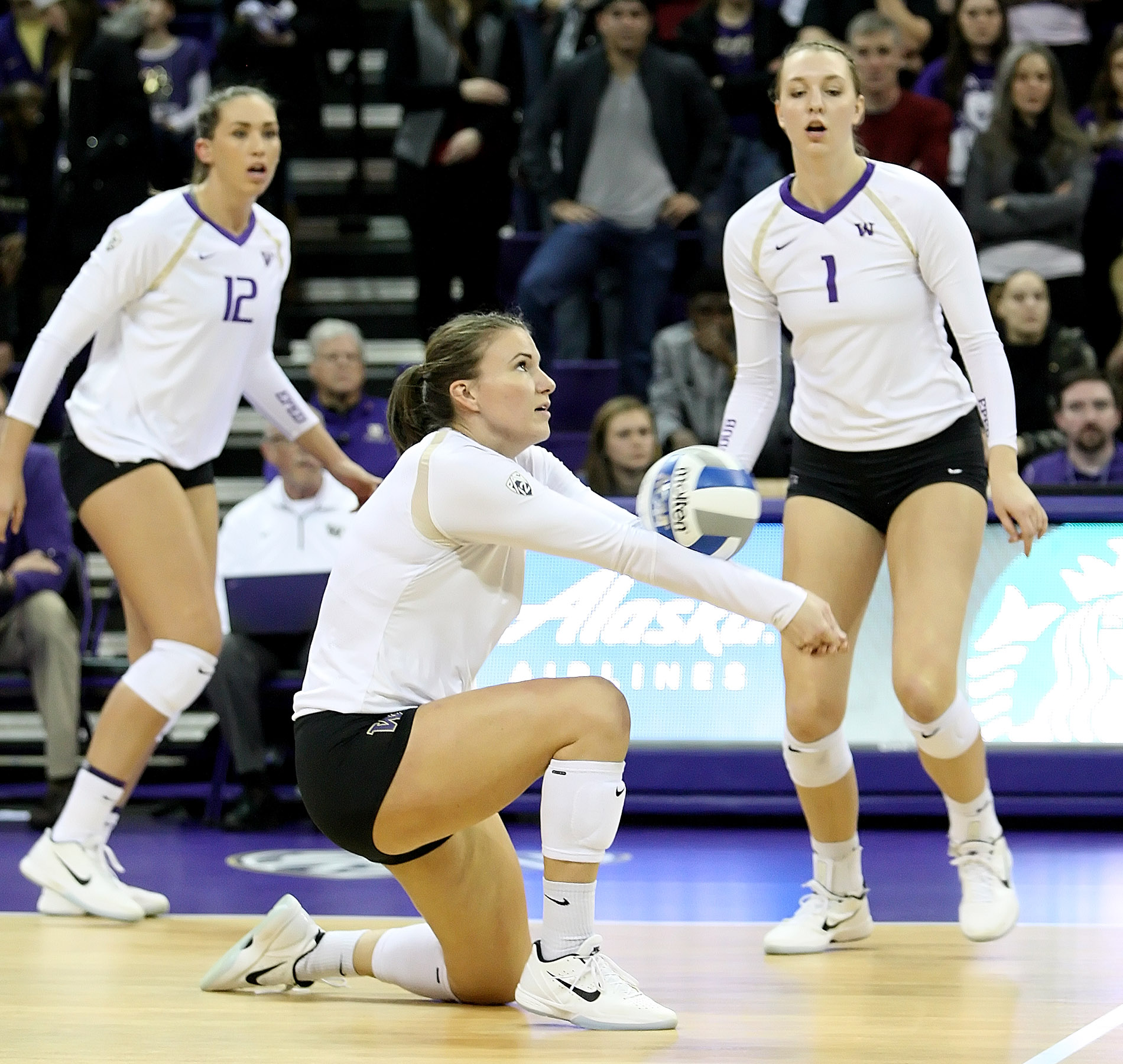 Washington's Courtney Schwan digs the ball.