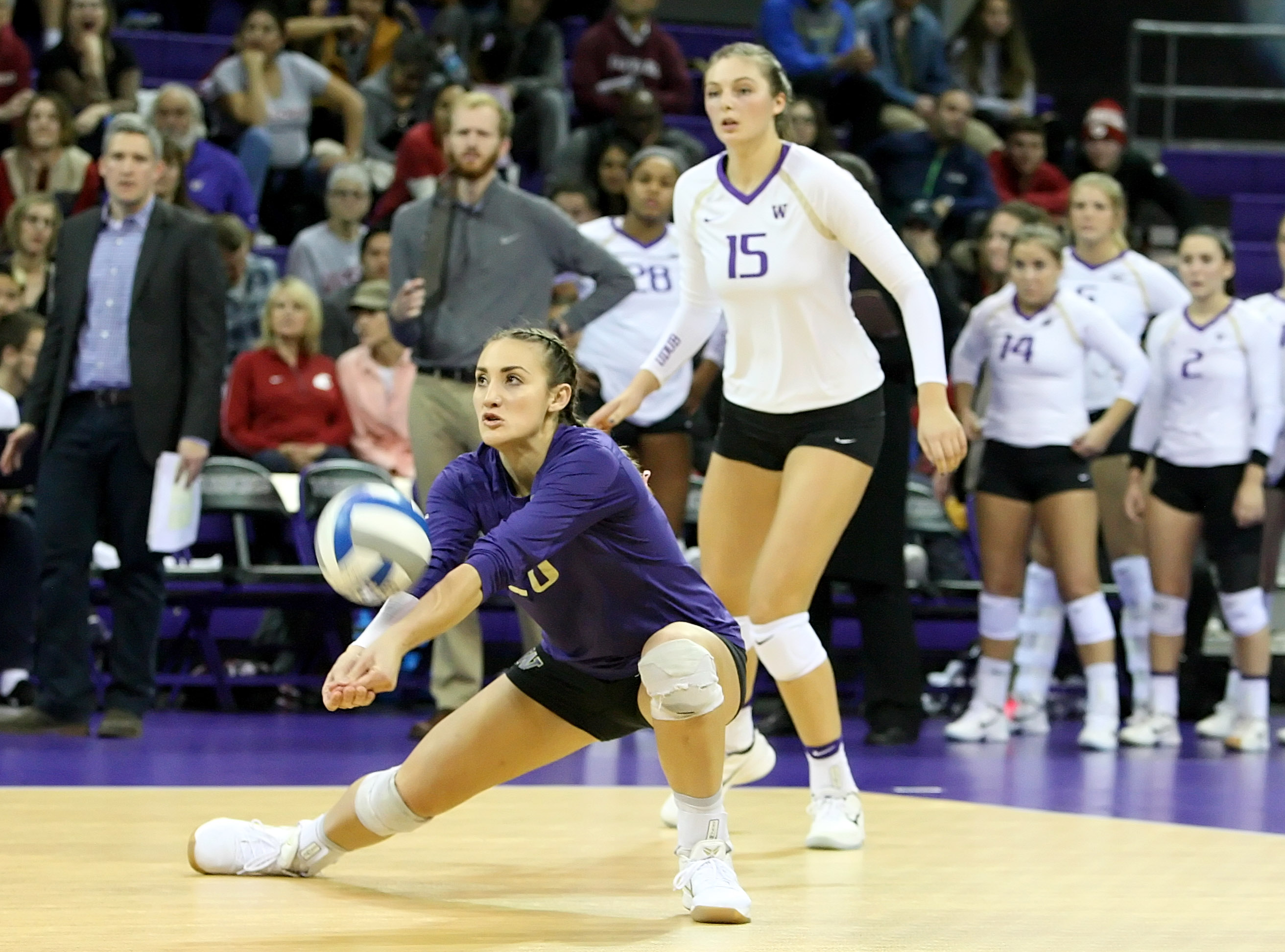 Washington's libero Tia Scambray digs for the ball.