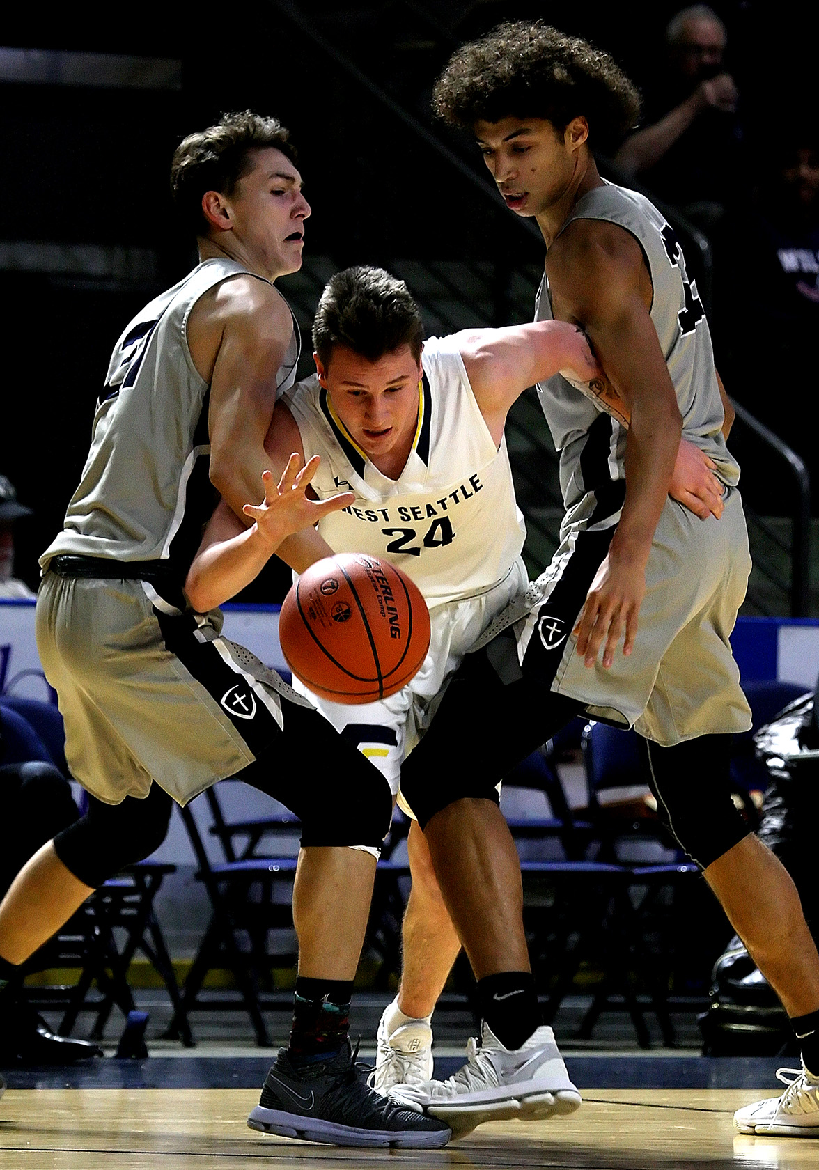 Simon Harris of West Seattle gets sandwiched between Gonzaga Prep’s Liam Lloyd and Anton
