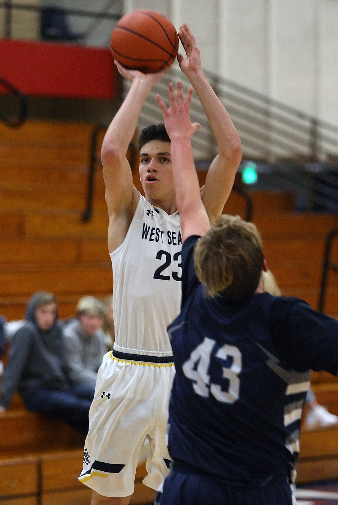 Anthony Giomi of West Seattle puts up a shot against Squalicum's Kendall Engelhart.