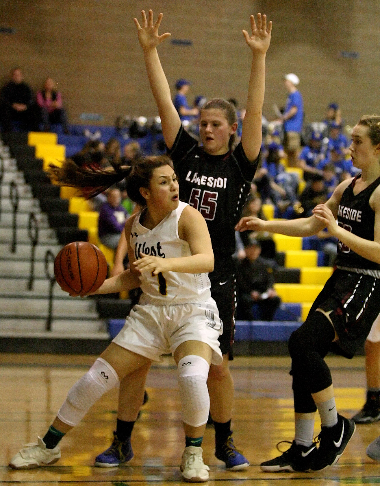 Kaiya Mar of West Seattle finds herself trapped under the basket looking to pass.