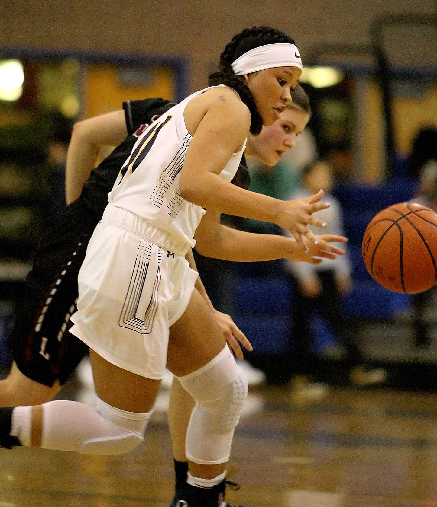 Jasmine Gayles of West Seattle and Lakeside's Grace Harrington go after a loose ball.