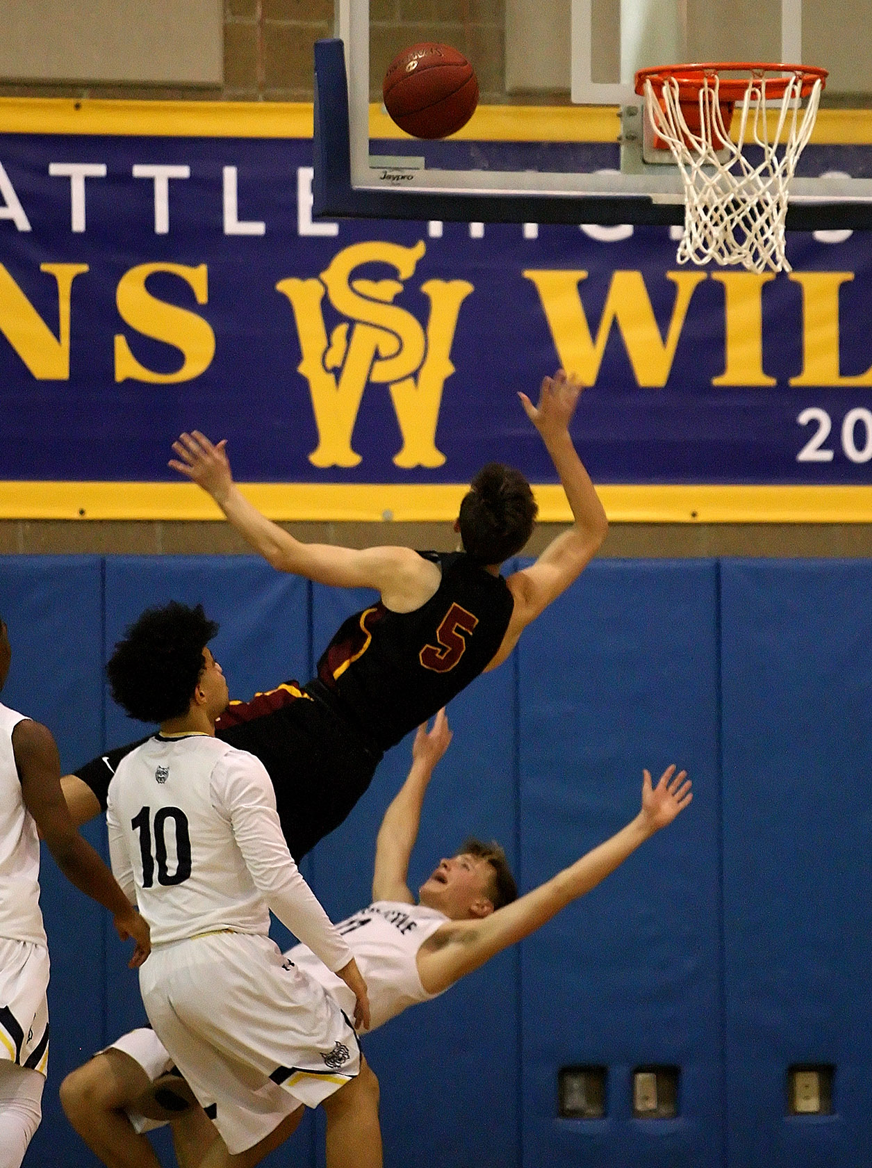 Jackson Golgart of West Seattle takes a charge from Lakeside's Alex Malcolm.