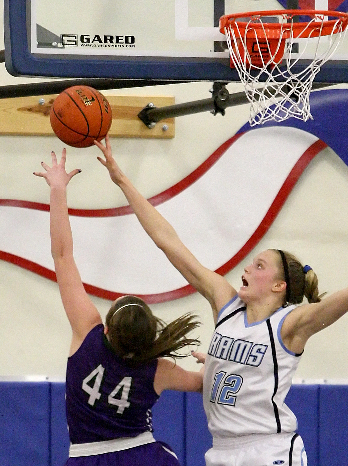  Flashback to high school: Defensive specialist, Brittany McPhee of Mt Rainier High School, blocks a shot near the basket.