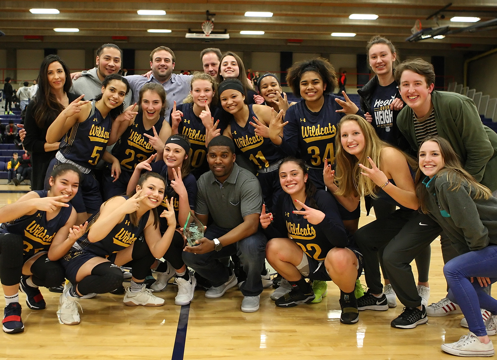 District champs West Seattle pose for a team photo after their win.