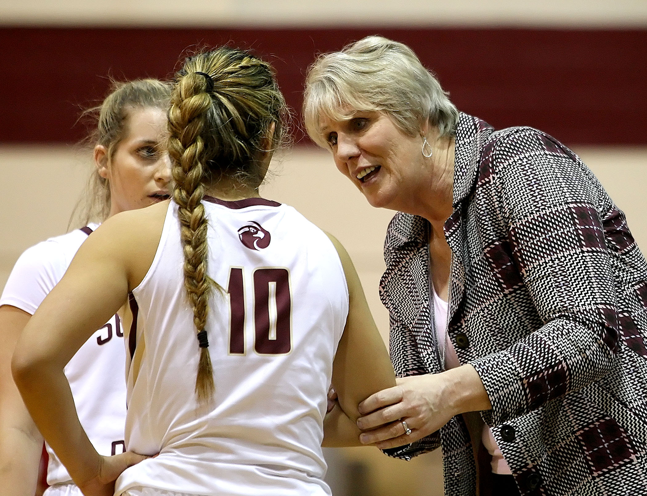 Seattle Pacific’s coach Julie Heisey talks over the game plan.  