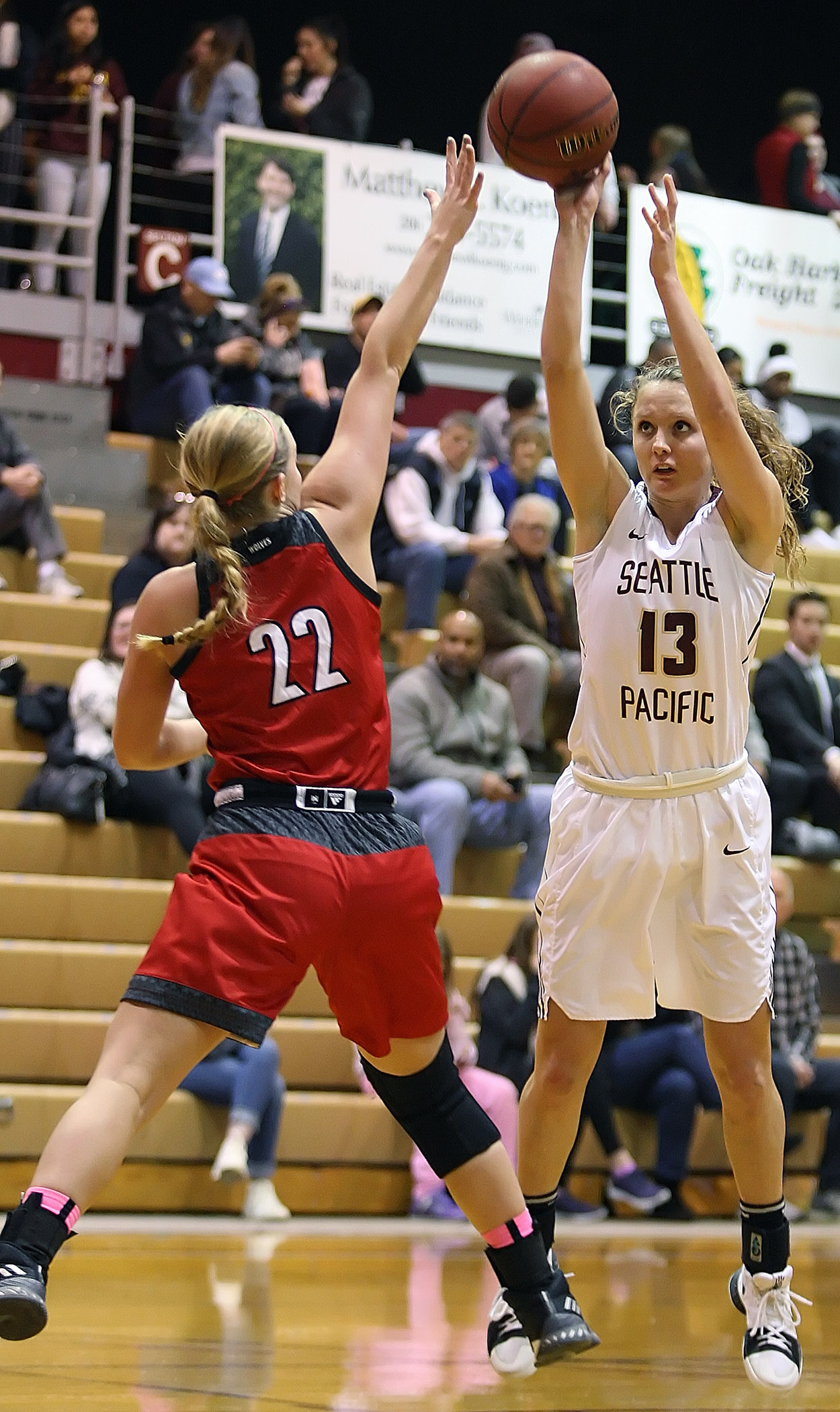 Jordan McPhee of Seattle Pacific takes a shot over Western Oregon’s Kaylie Boschma.