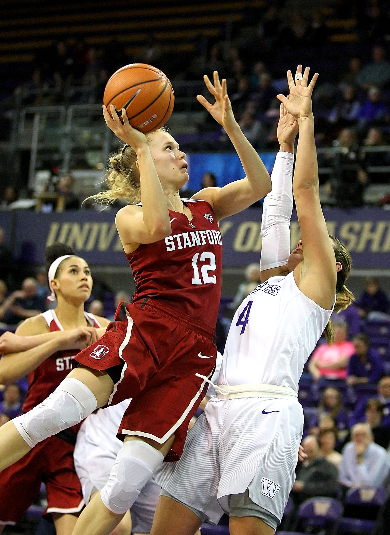Brittany McPhee of Stanford makes a basket against Washington’s Amber Melgoza. 