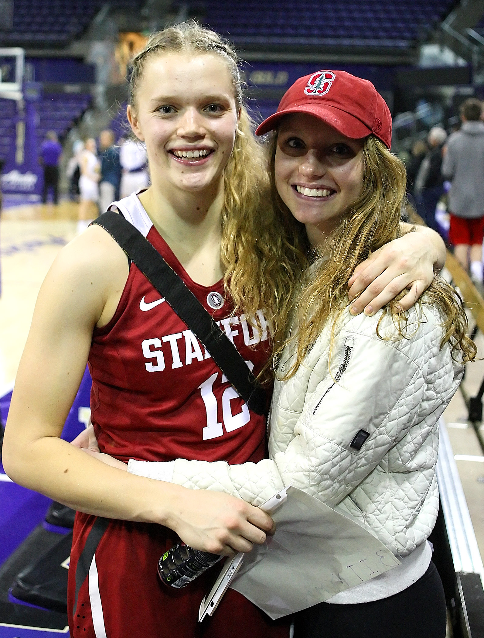 After the game twin sisters Brittany McPhee of Stanford and Jordan McPhee of Seattle Pacific University pose for a photo.