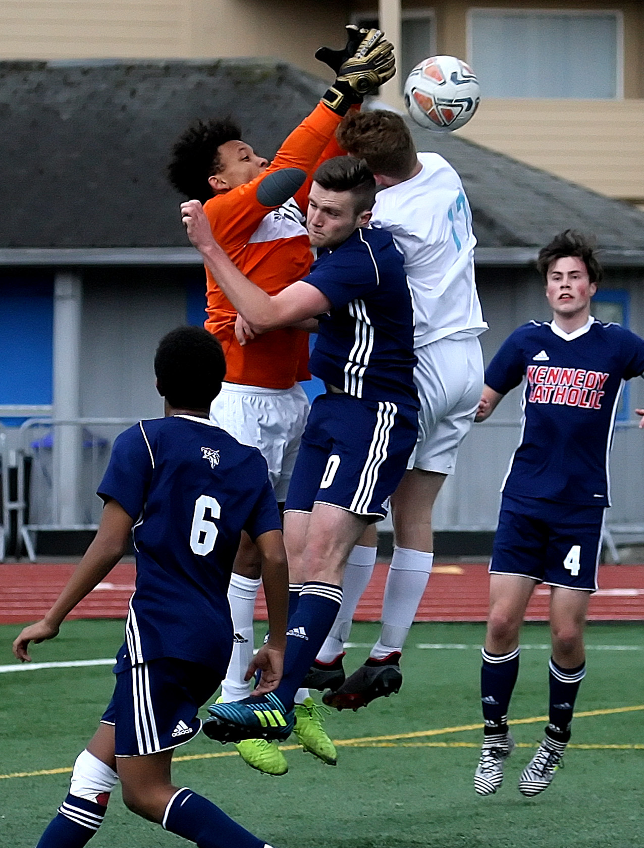 Kennedy Catholic's goalie tries to grab the ball in a crowd.