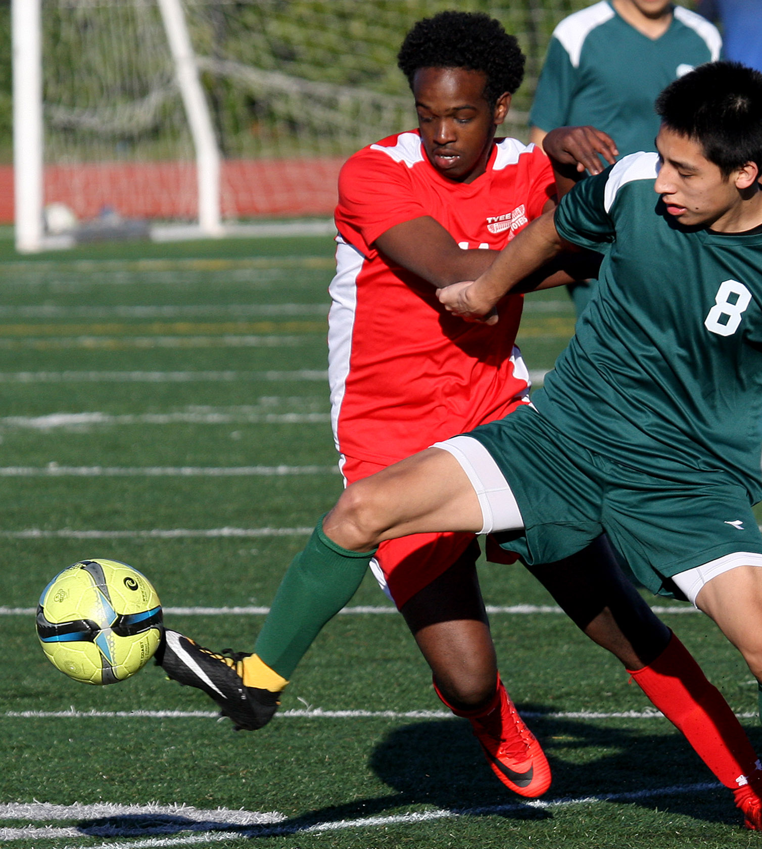 Delbert Vasquez of Evergreen gets his toe on the against Tyee's Mohamed Mohamed.