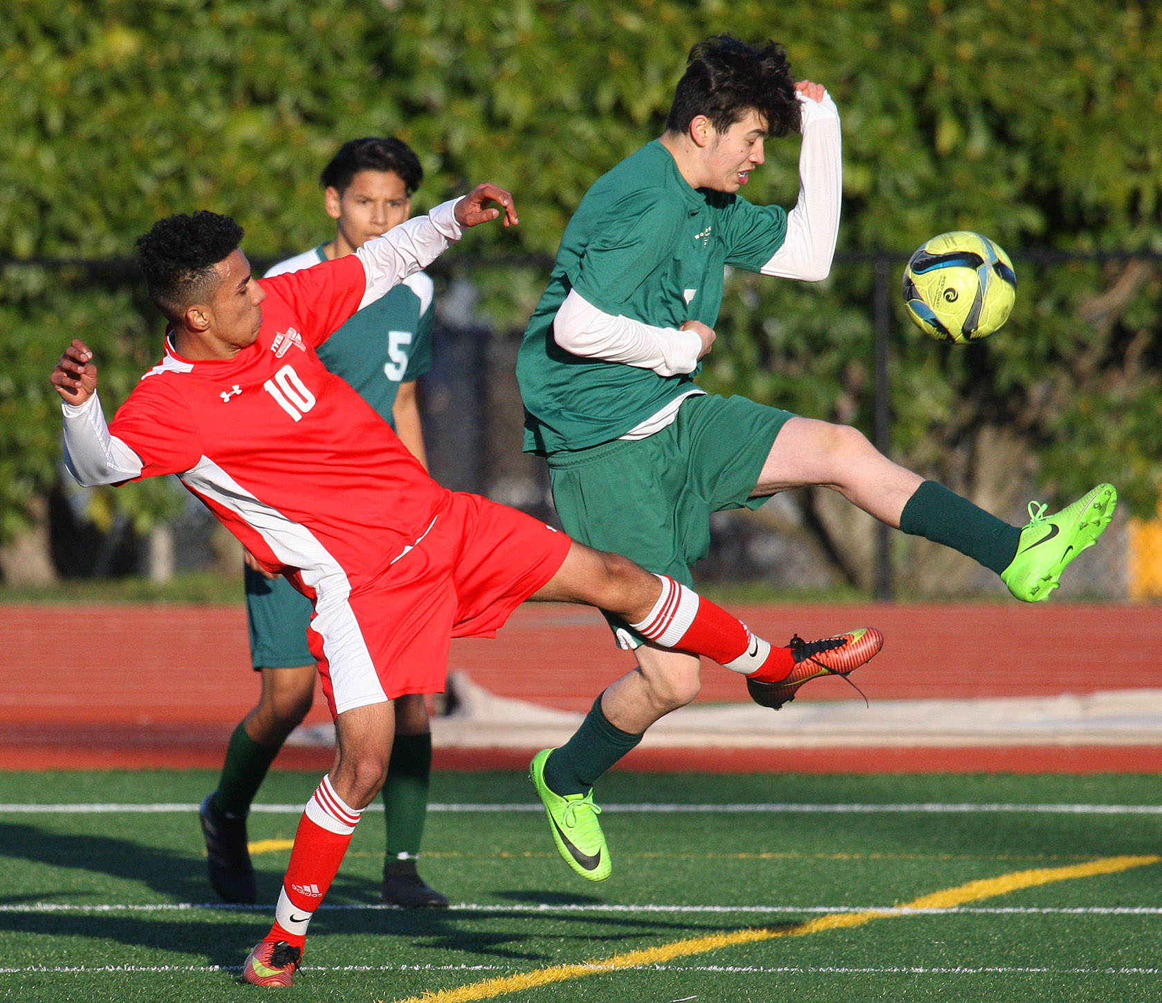 The ball gets away from Cesar Santamaria of Tyee and Evergreen's Josue Pedroza.