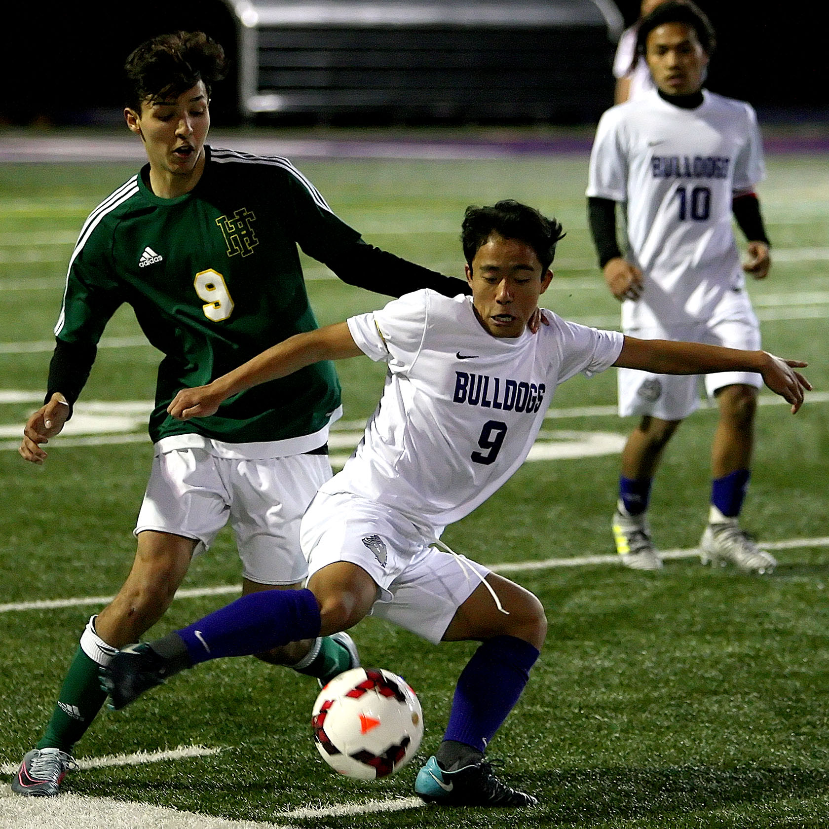 Gin Piang of Foster controls the ball against Foss's Jacob Rodriques.