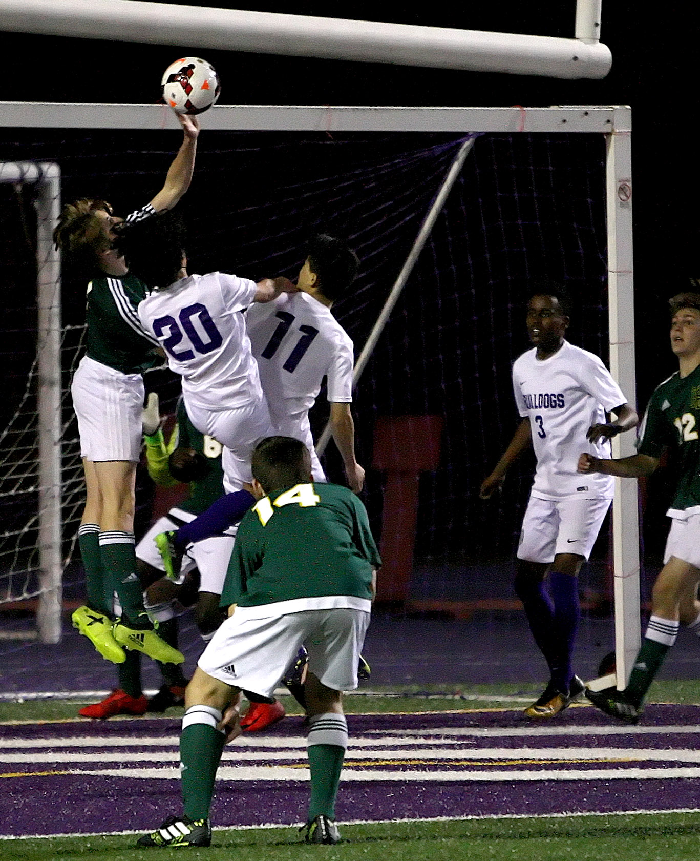 Alex Lyro of Foss blocks the shot at the goal. Wait, this isn't basketball and he isn't the goalie. PENALTY!