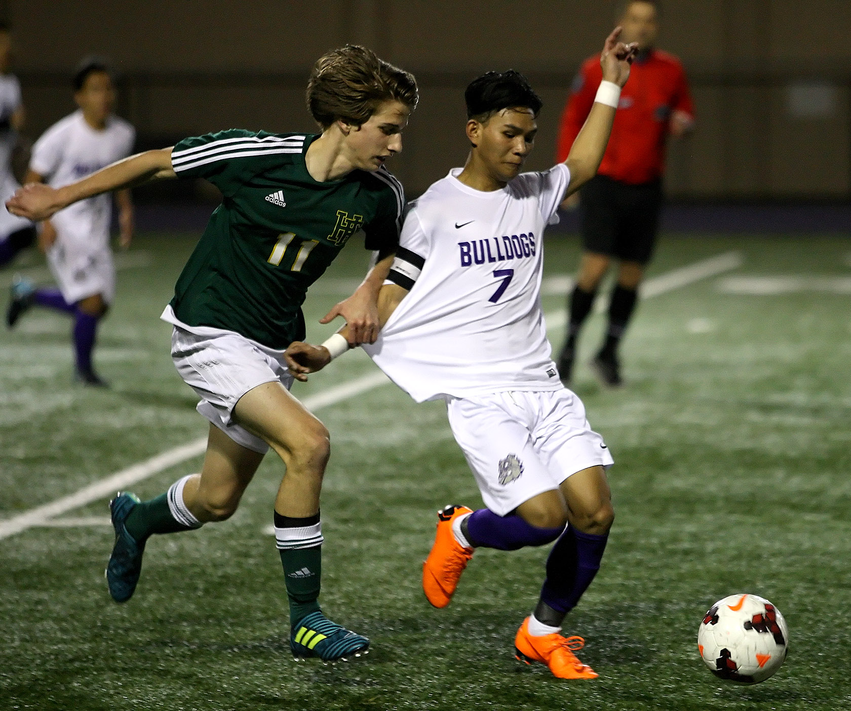 Bik Ceu of Foster gets to the ball before Foss's Isaac Lyro.