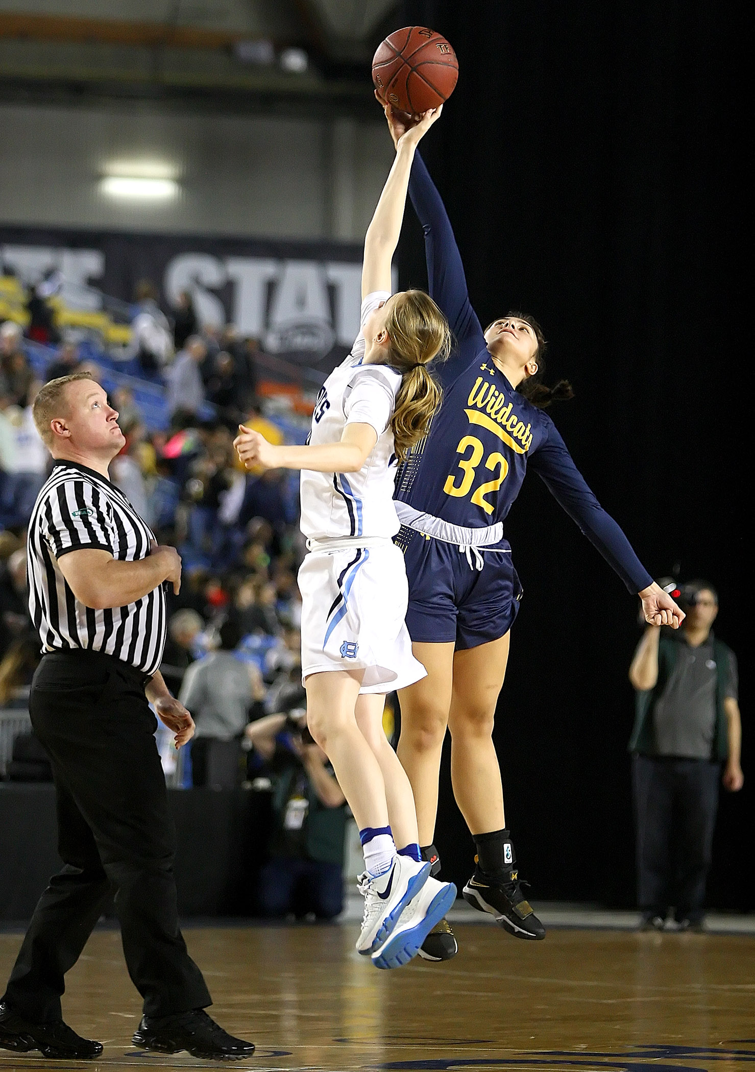 Opening tip-off has Meghan Fiso of West Seattle against Gig Harbors Brynna Maxwell.