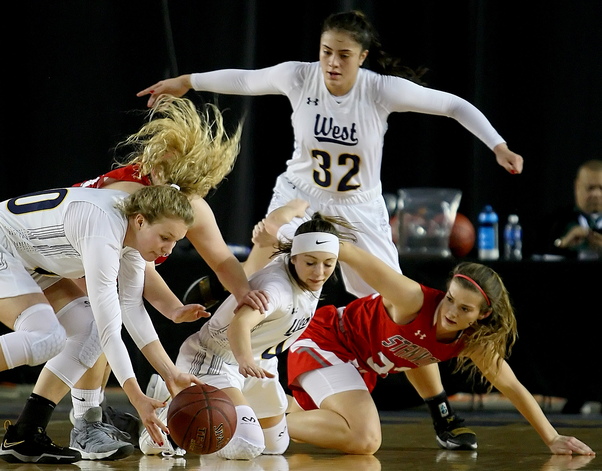 West Seattle and Stanwood players scramble for the ball.