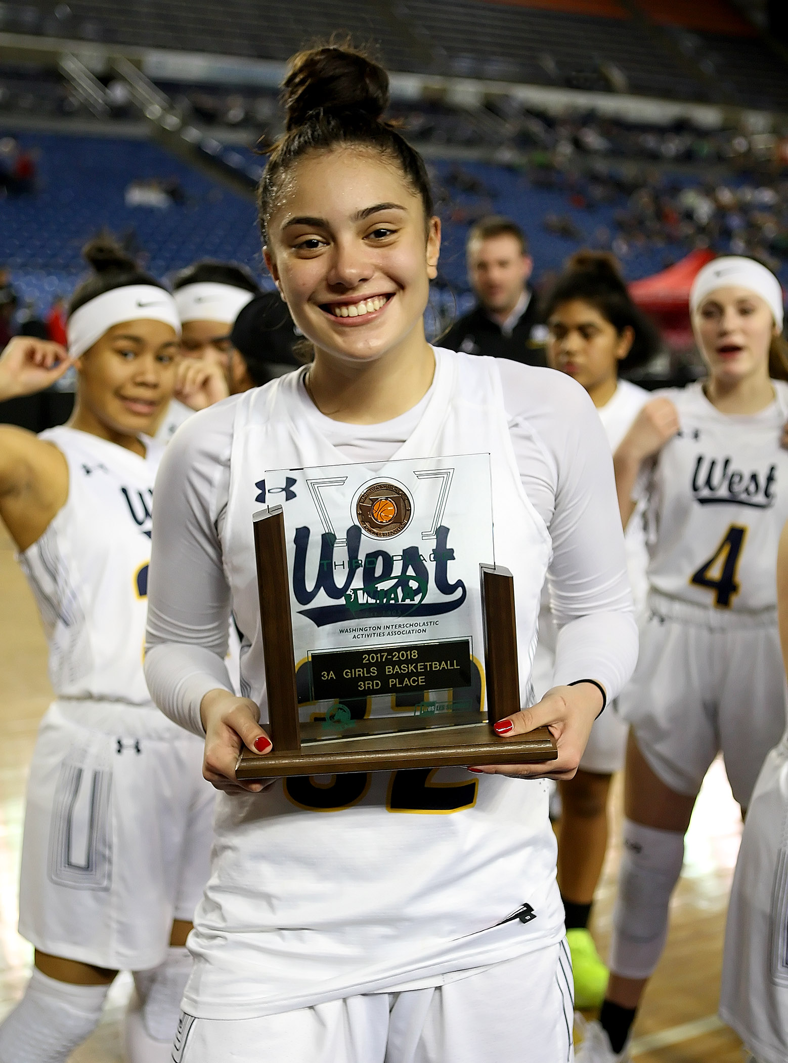 West Seattle's Meghan Fiso shows off the teams 3rd place award.