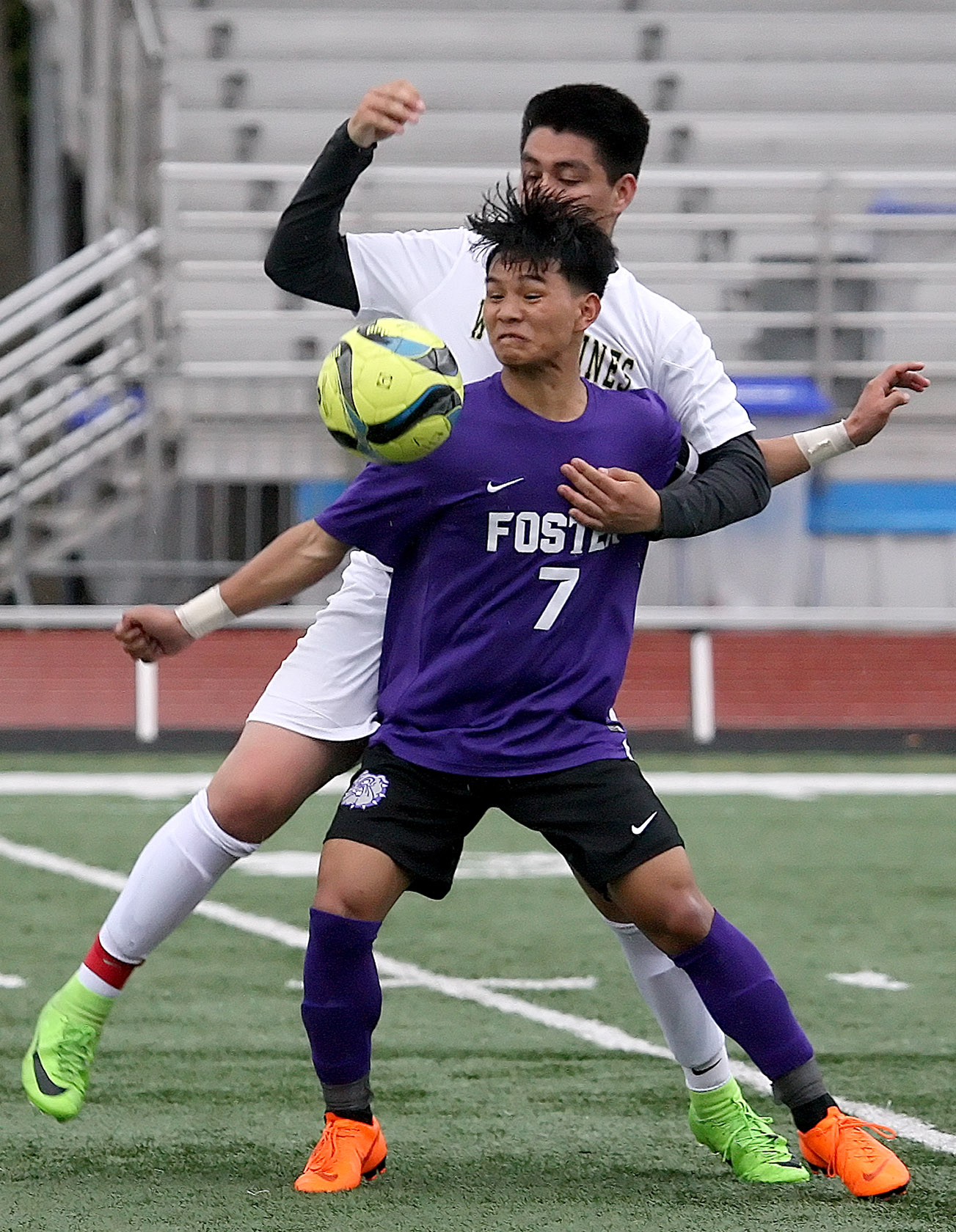 Bik Ceu of Foster blocks Evergreen's Josue Pedroza from getting to the ball.