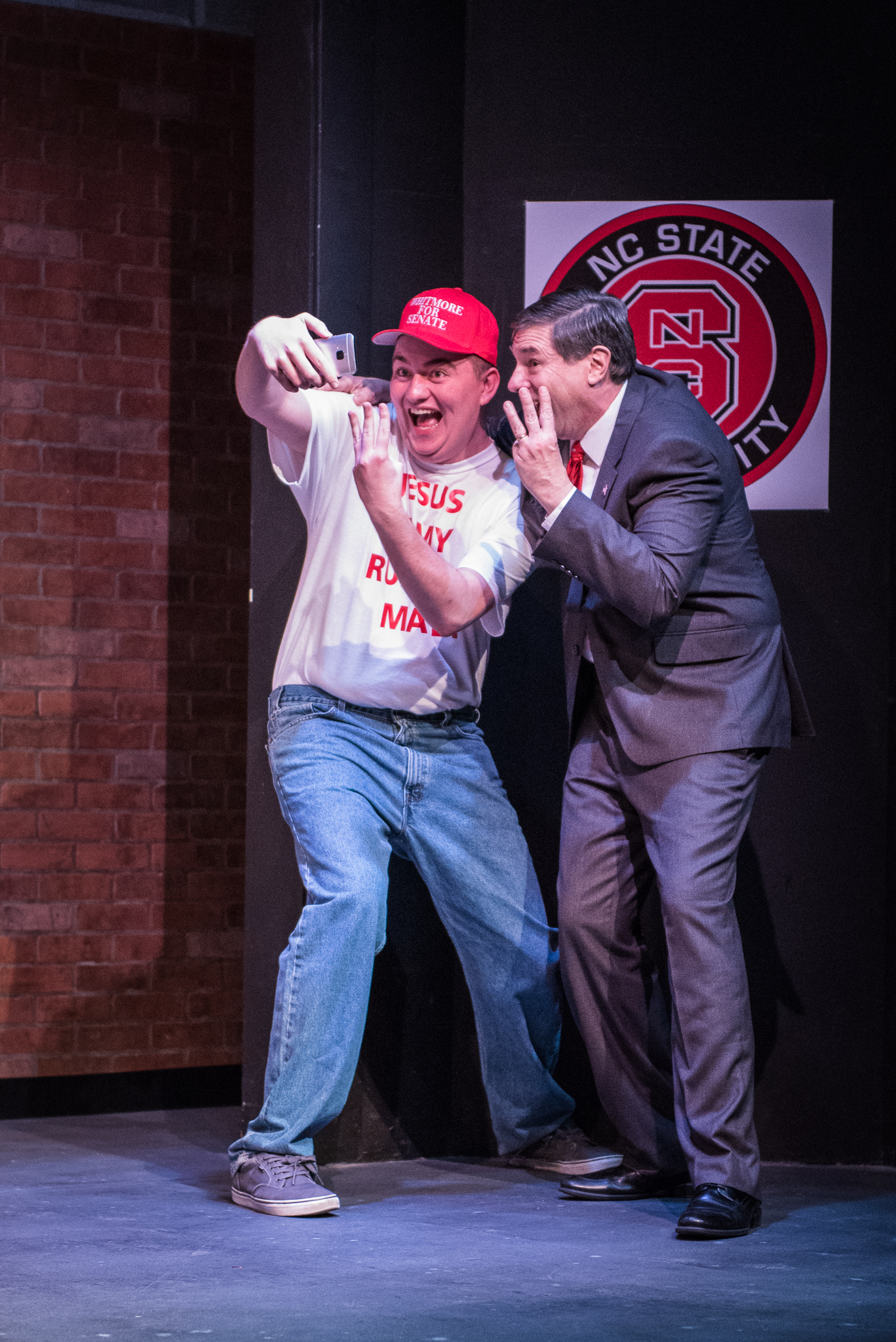 From left, Tom  (Max Lopuszynski) snaps a selfie with Senator Charles Whitmore (Gianni Truzzi) in the dramedy “Church & State,” written by Jason Odell Williams, performing at Burien Actors Theatre  through May 20.