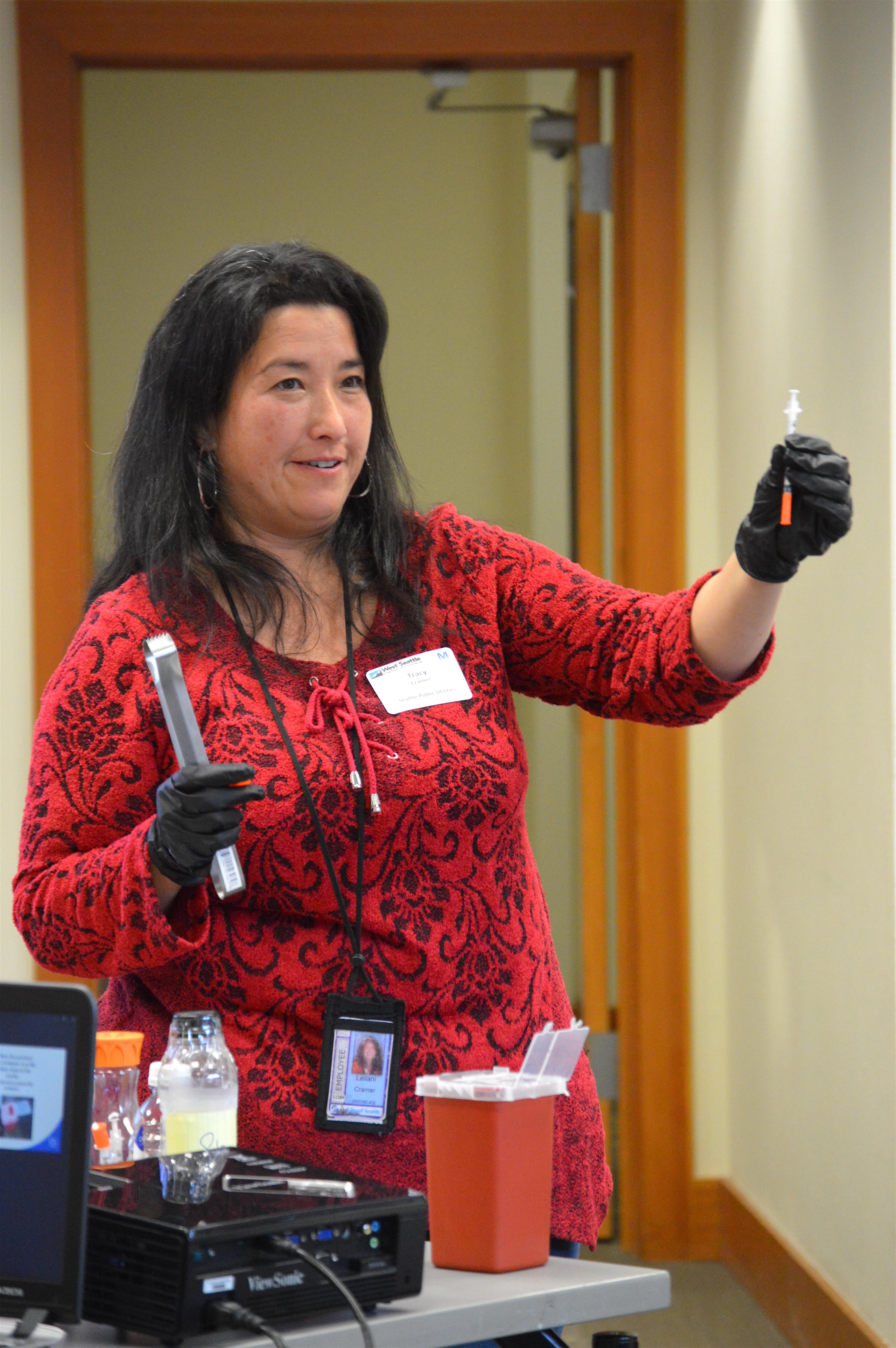 Tracy Cramer, lead clean city inspector with Seattle Public Utilities, demonstrated the proper methods for disposing of used needles during a recent luncheon hosted by the West Seattle Chamber of Commerce.