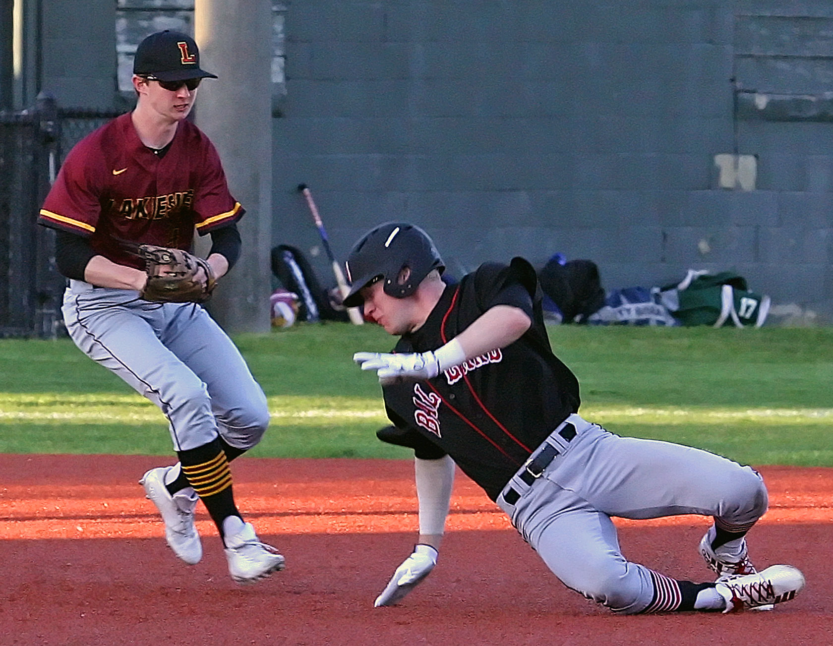 Thomas Helean of Ballard gets caught in a pickle as Lakeside's Charlie Wright tags him out.