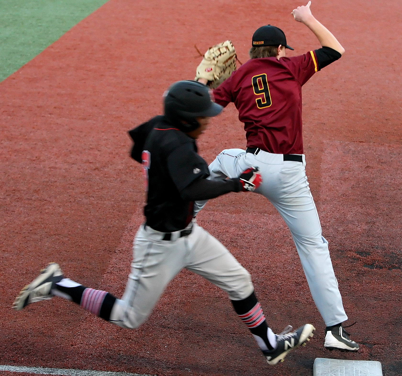 Base runner Keanu Romero of Ballard is call out at first as the umpire claimed Lakeside's Angus Dillon touched the base first.
