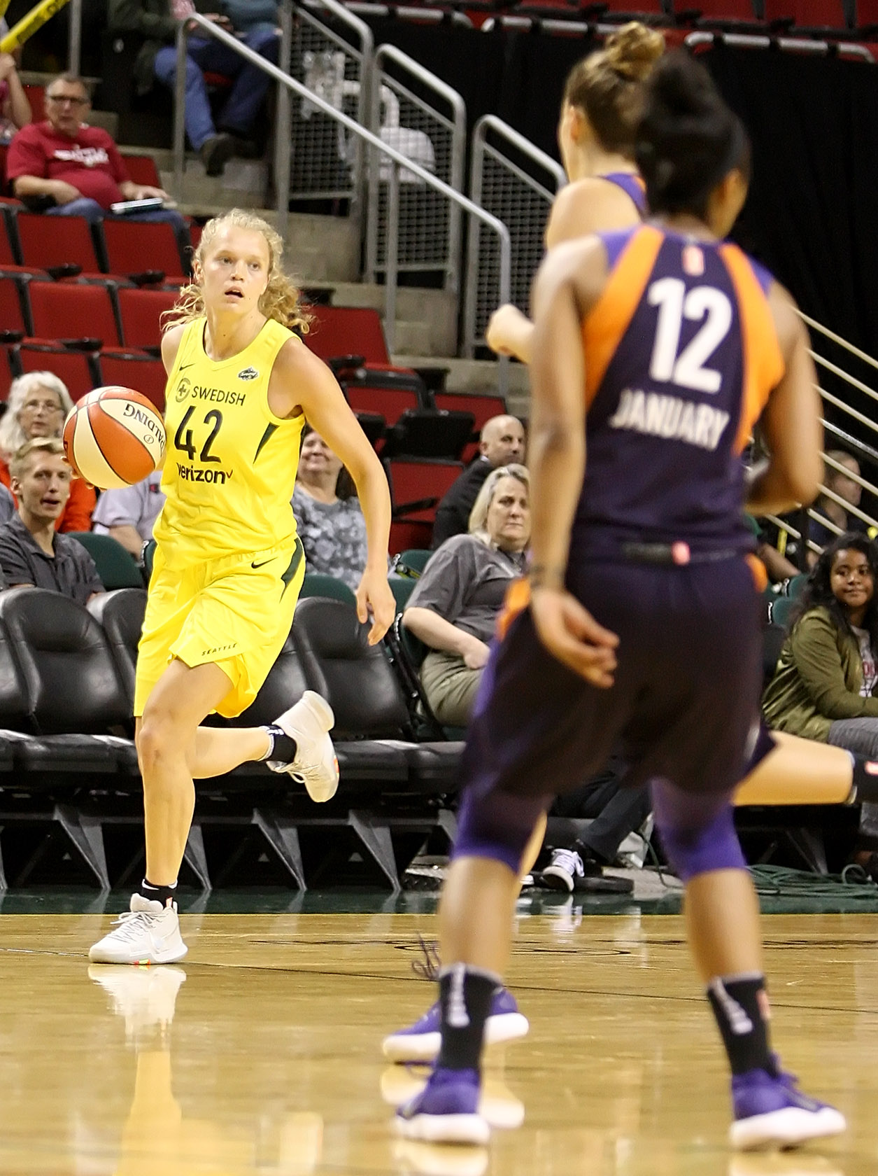 Brittany McPhee brings the ball up court. 