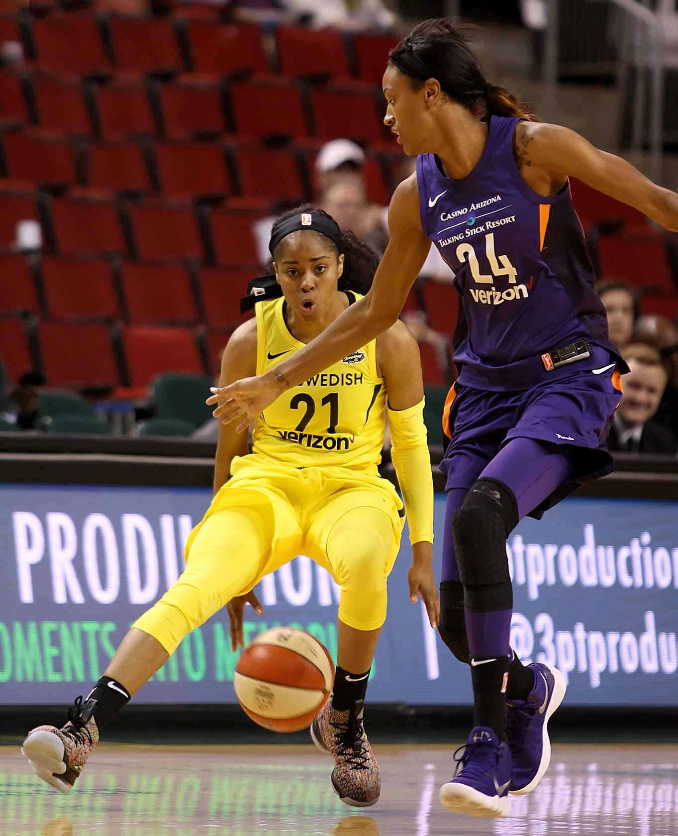 Jordin Canada of the Storm dribbles the ball between her legs against the Mercury's DeWanna Bonner.