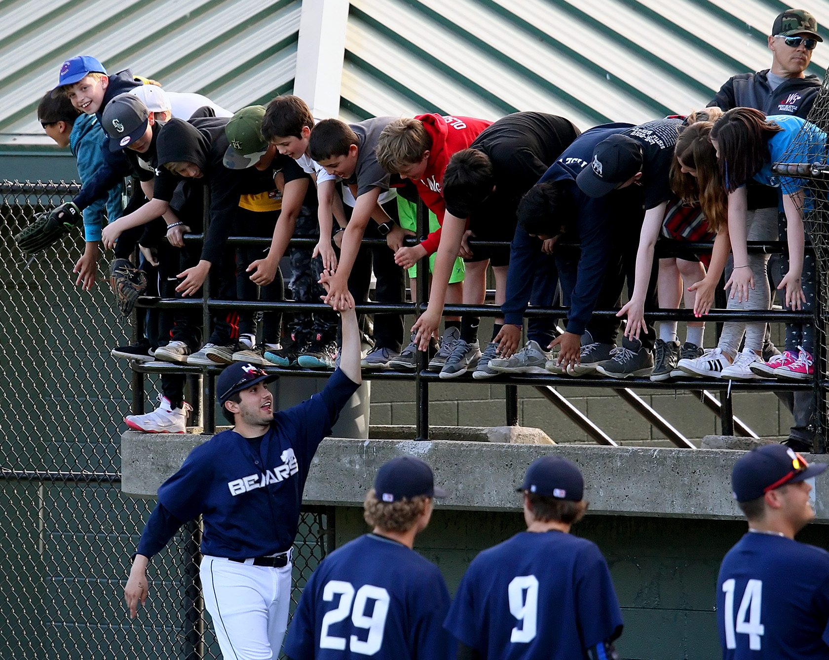 During the Highline Bears team introductions some young fans get high fives from the players. Photo by Kurt Howard