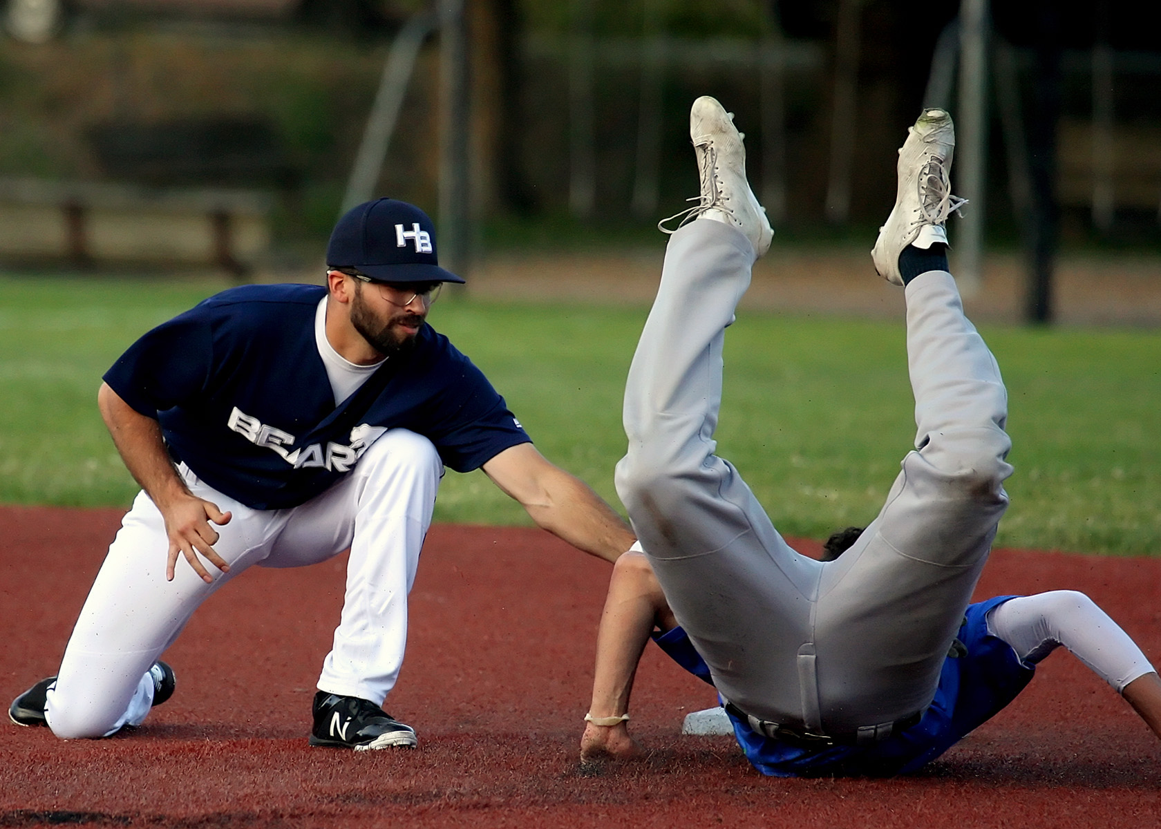 Colton Robinson of the Bears tags the Emeralds Sam Linscott out as he performs a graceful scorpion slide into second base.