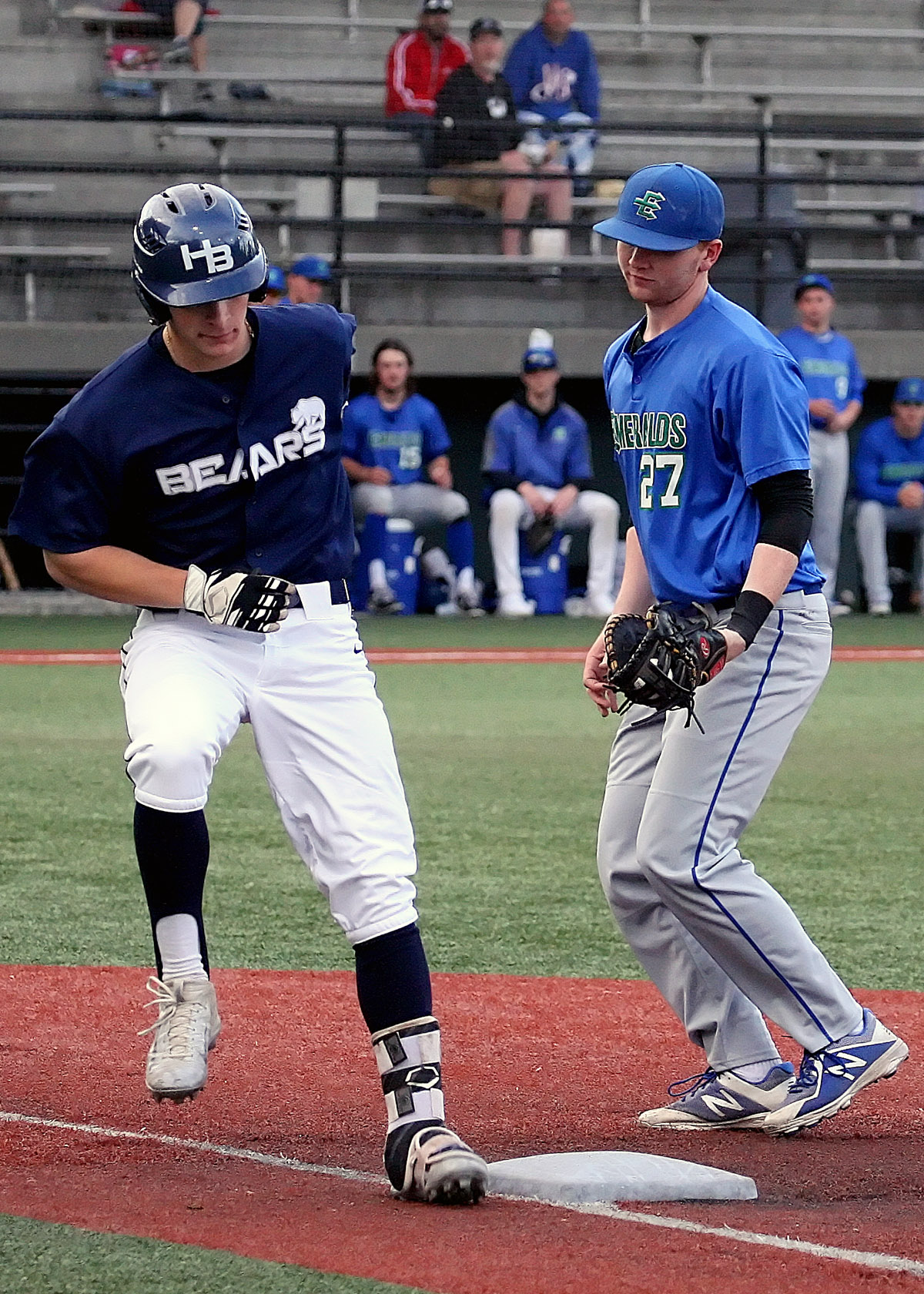 Alex Bryner of the Bears is safe at first because the Emeralds David Gibons didn't touch the base. 