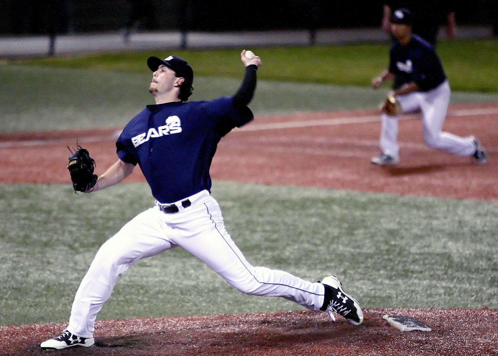 The Bears closing pitcher Connor Bensen delivers his pitch home.  