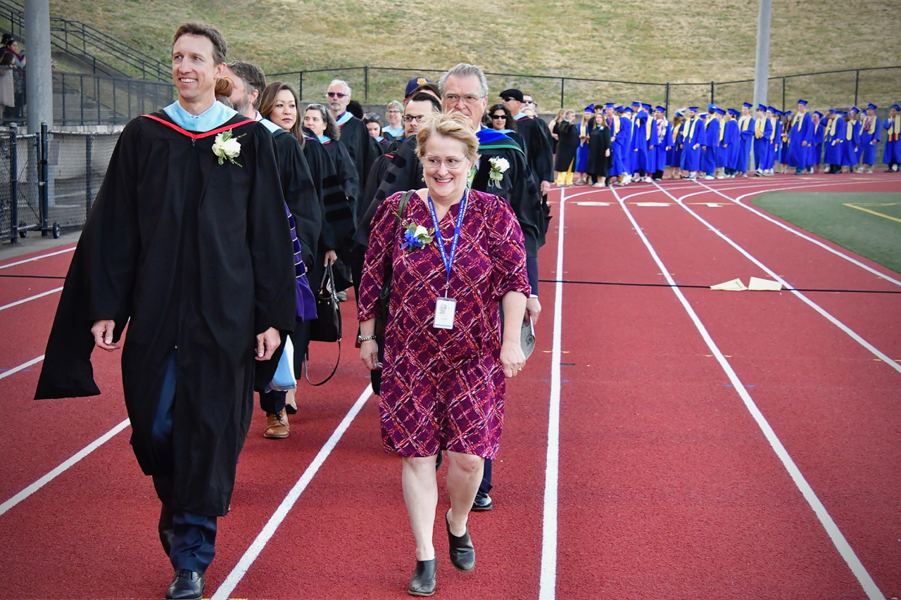 Principal Brian Vance and Madalyn Stewart lead the procession. Photo by Patrick Robinson