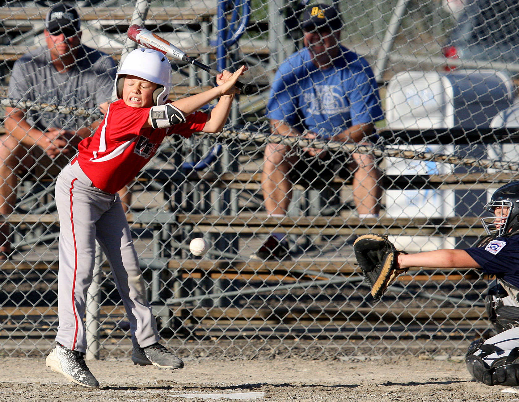 Jesse LaBella of West Seattle avoids being hit by the pitch.