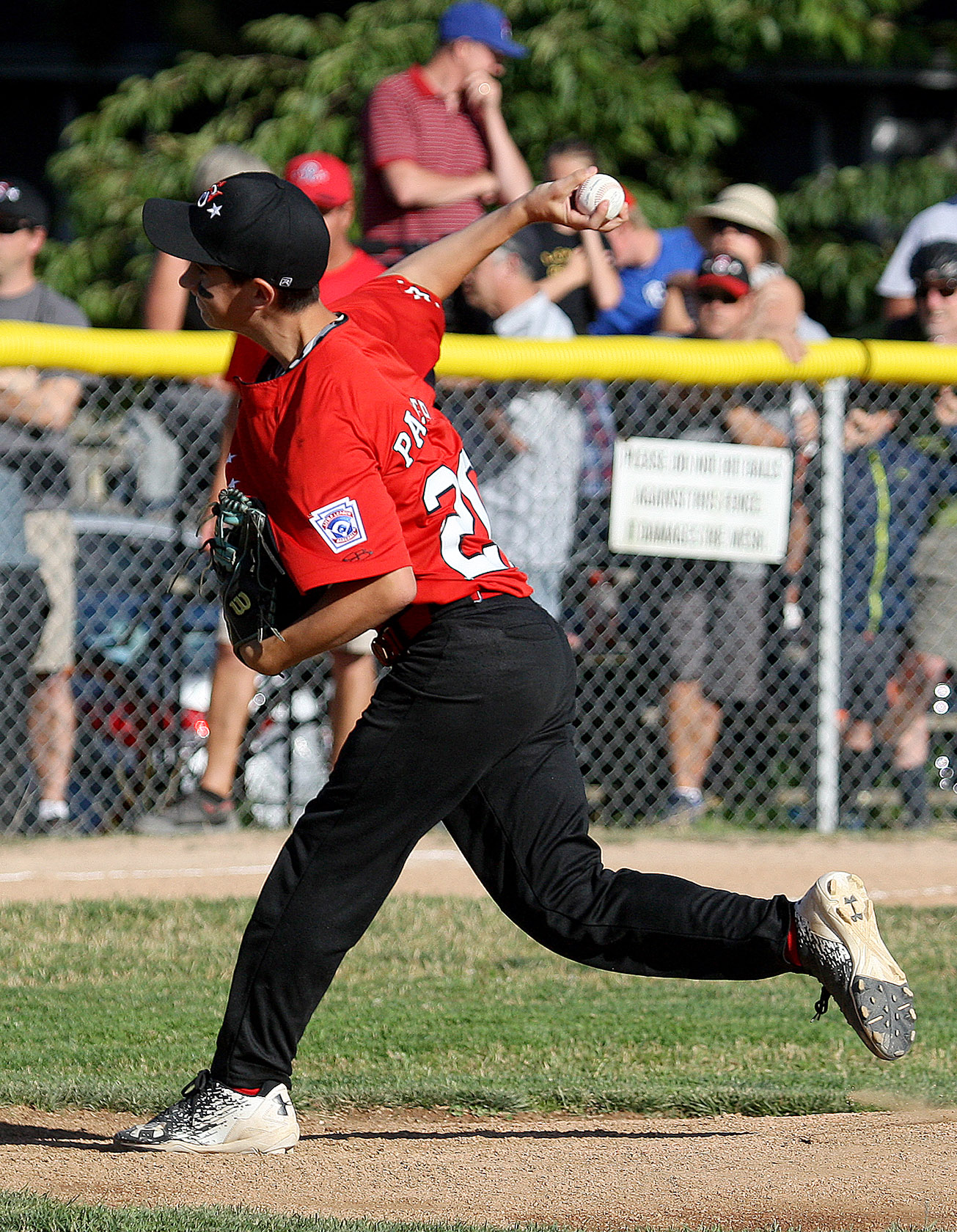 West Seattle's starting pitcher Eli Palmer delivers his pitch home.