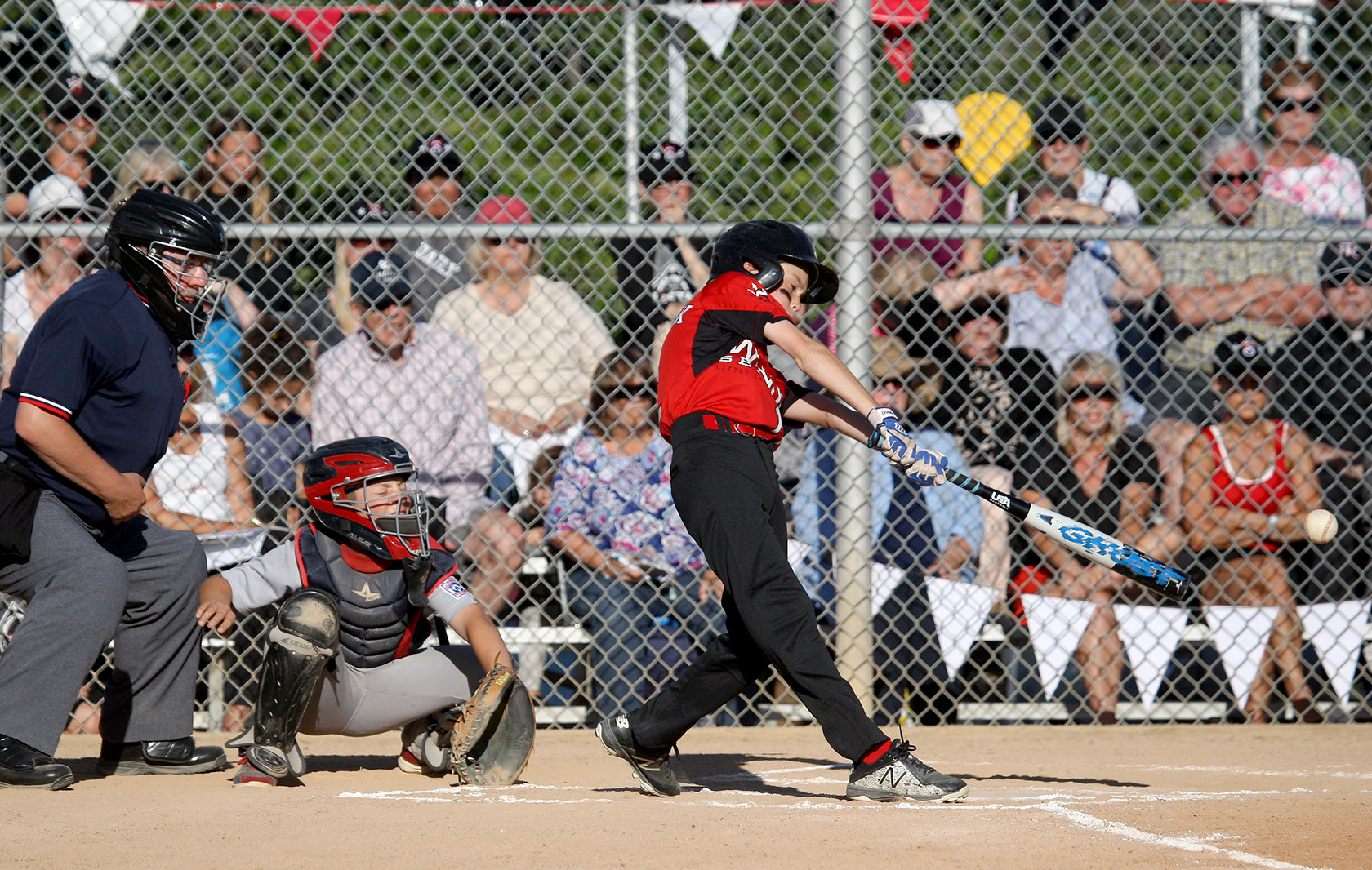 Joe Sherick of West Seattle gets a base hit.