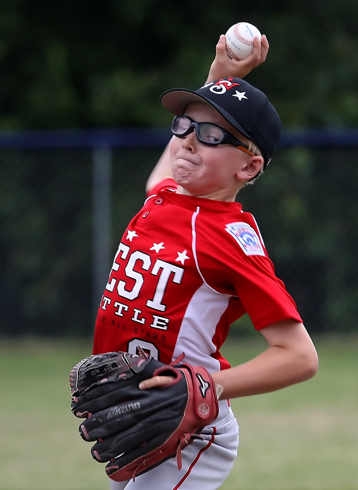 Max Cooper of West Seattle delivers a pitch home.