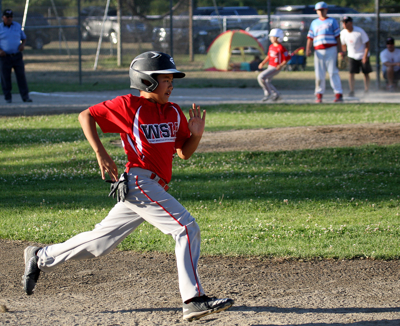 Cody Sazama of West Seattle heads to third.