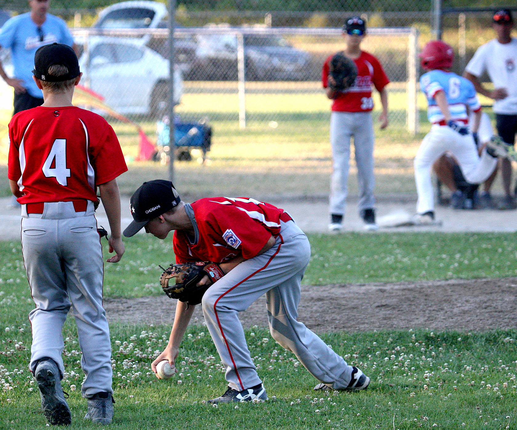 Ivan Moore of West Seattle is too late to get off a throw to get out West Valley's Brandt Kneisler out at first.