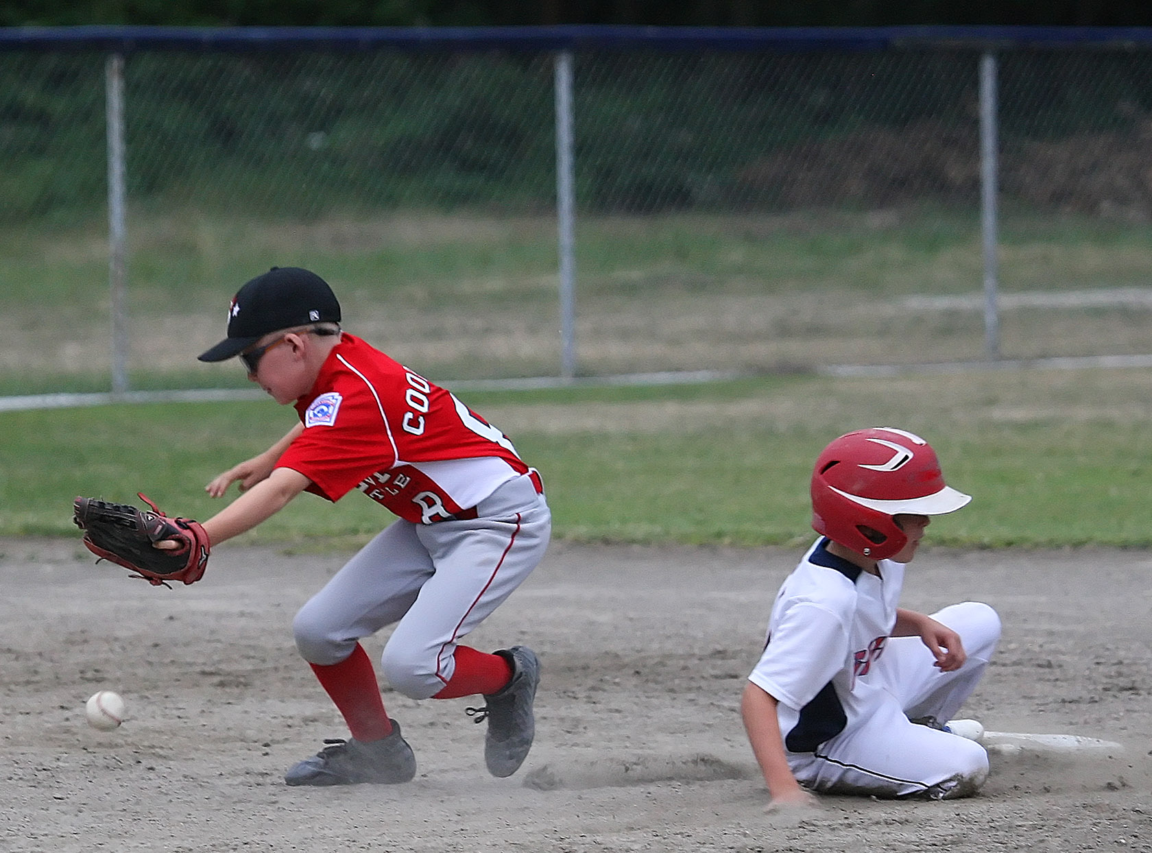 Max Cooper of West Seattle goes after the ball as South Highline Nationals Jayce Fitzgerald gets back to second.