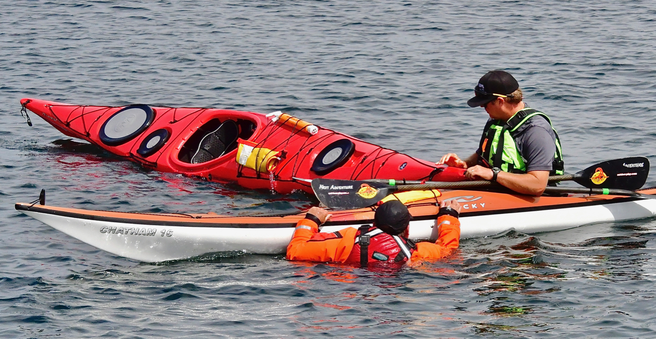 Greg tips Jim's kayak