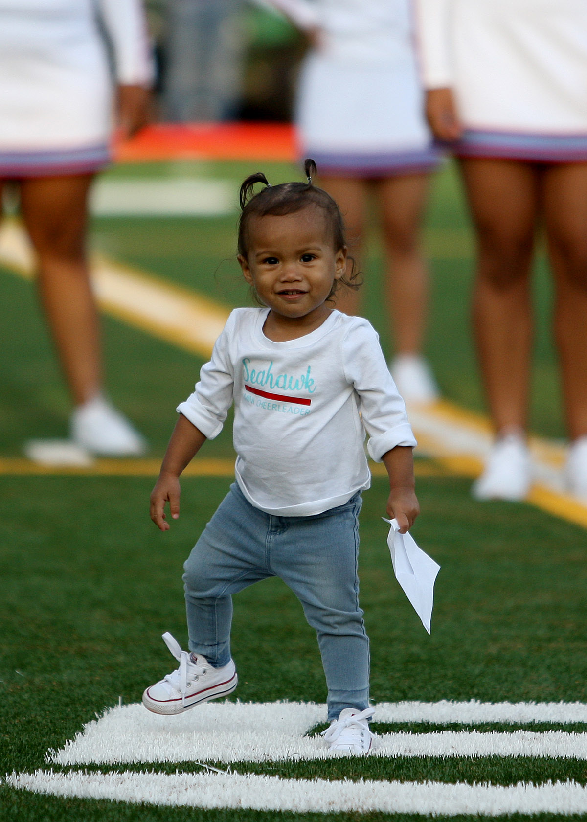 Addy, who is wearing a "Seahawk Mini Cheerleader" t-shirt is part of the pregame show.