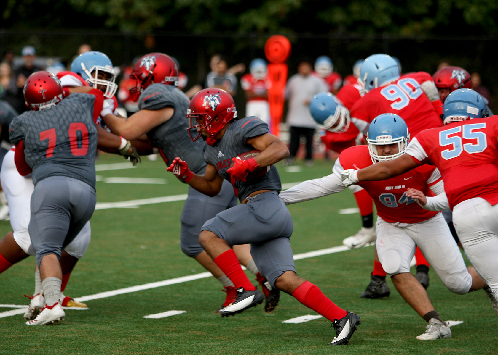 Zaire Lazolo of Kennedy carries the ball up field.