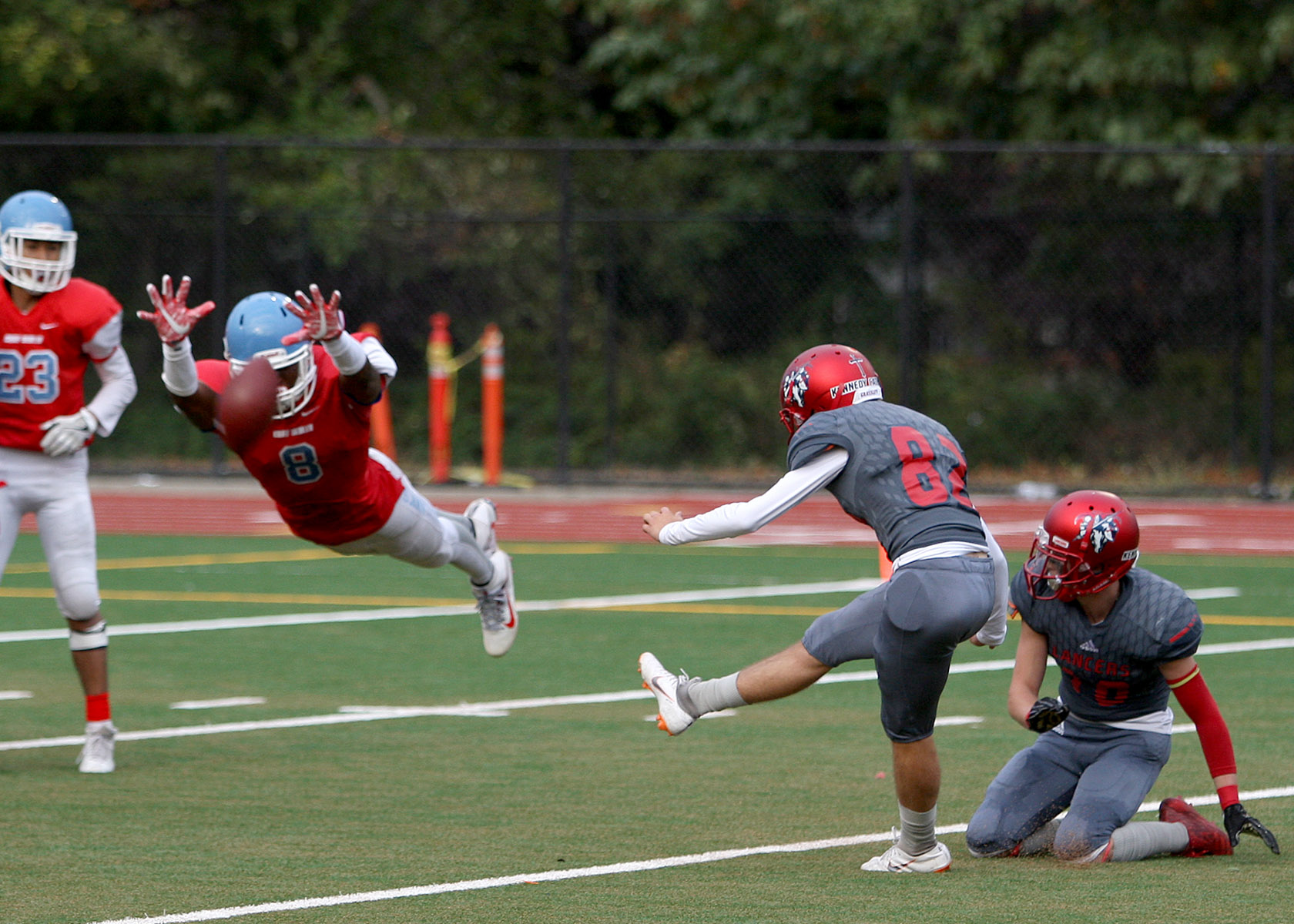 Dontea McMillen of Chief Sealth blocks the extra point attempt by Kennedy's Ethan Grassley.