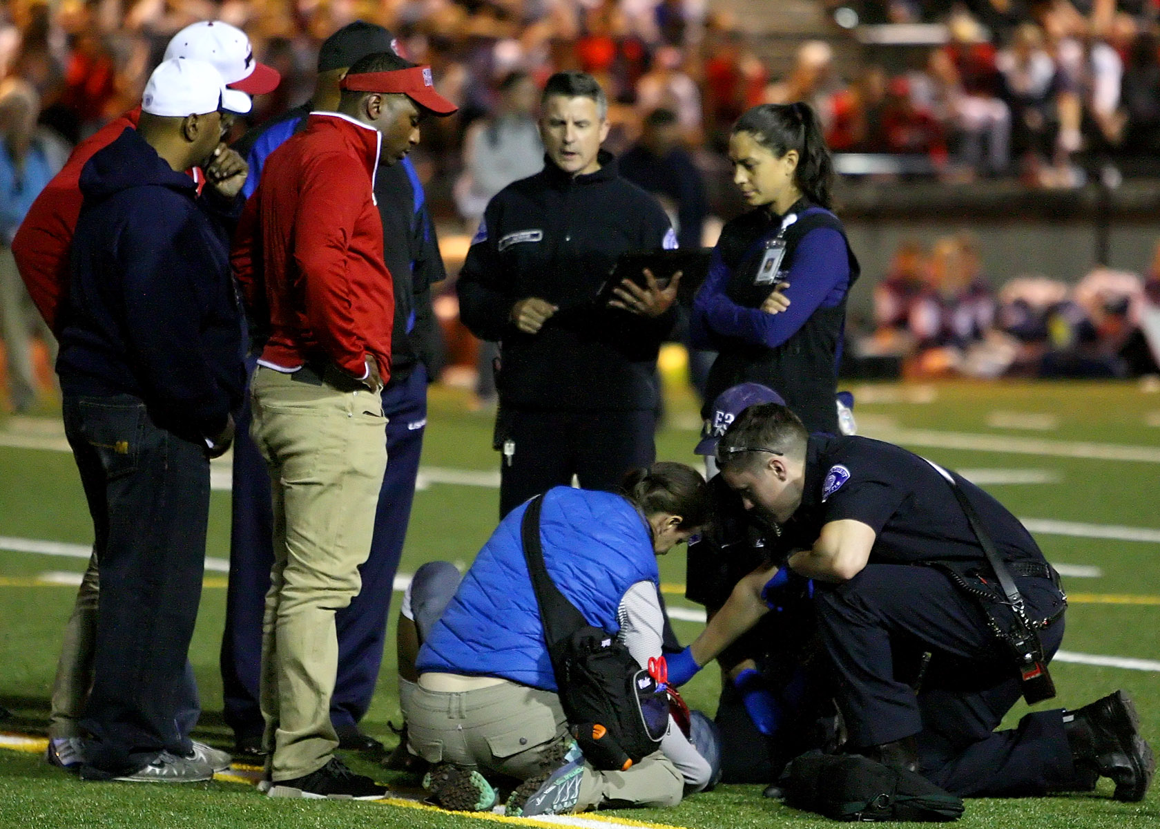  With 8 seconds to go before halftime Kennedy's Tre Holman is injured and medics are called in.