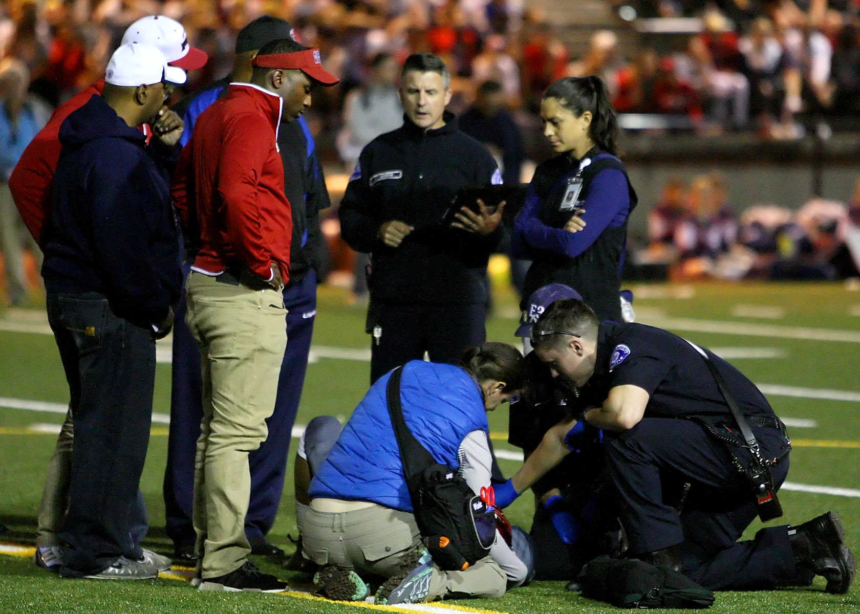 With 8 seconds to go before halftime Kennedy's Tre Holman is injured and medics are called in.