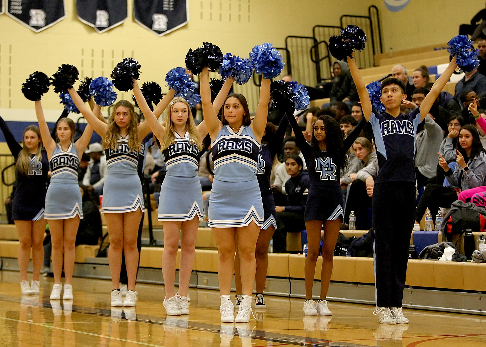 Mt Rainier's cheer leaders raise their pompoms during their teams free throw attempt.